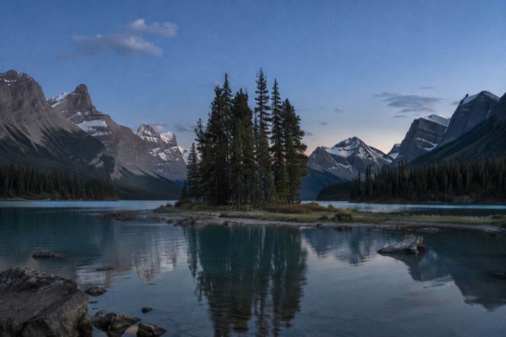 Spirit Island framed by mountains at the far end of Maligne Lake