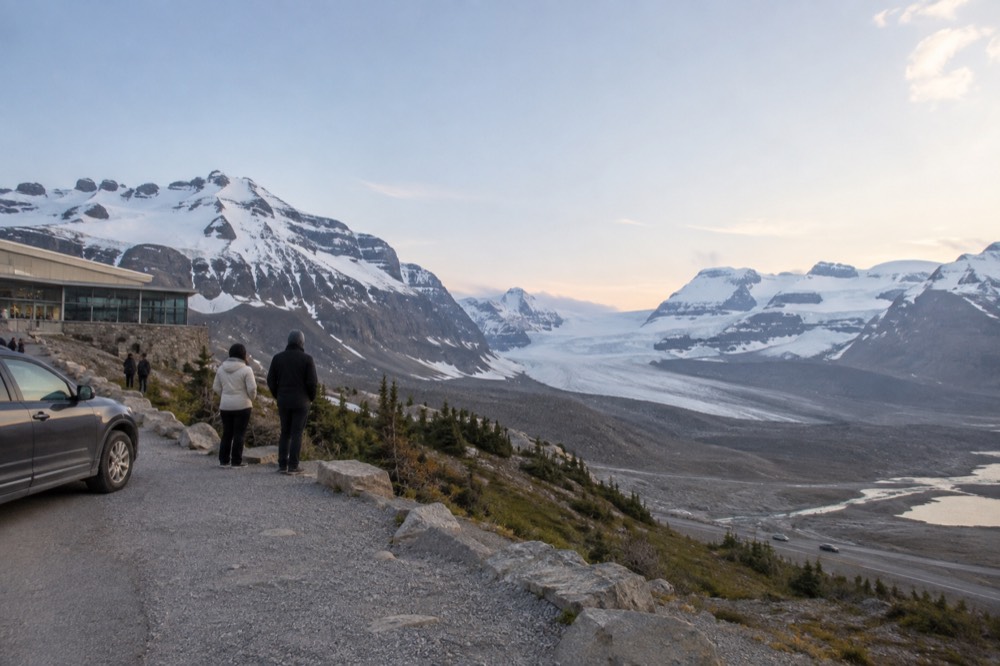 The Columbia Icefield and Athabasca Glacier seen from a roadside viewpoint under a wide sky