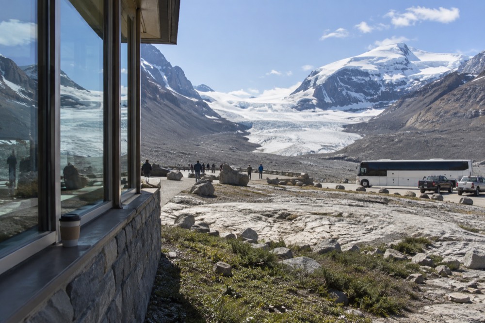 Columbia Icefield Discovery Centre and glacier view under a clear sky