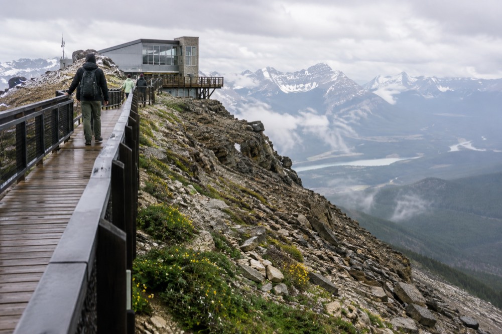 Mountain summit boardwalk stretching along a ridge above a river valley