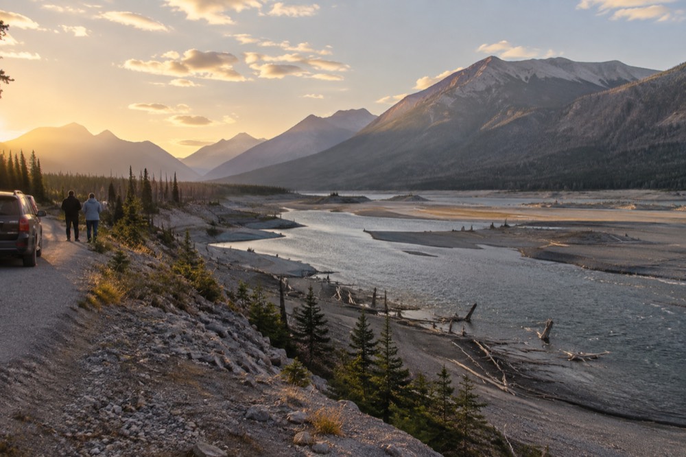 Golden autumn light on a mountain valley with a winding river below